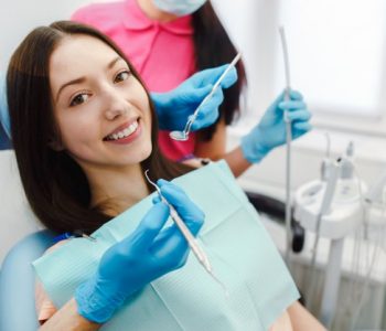 smiling woman dentist chair