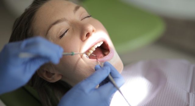 A dentist treating a patient's teeth