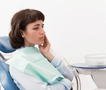 a woman having TMJ disorder